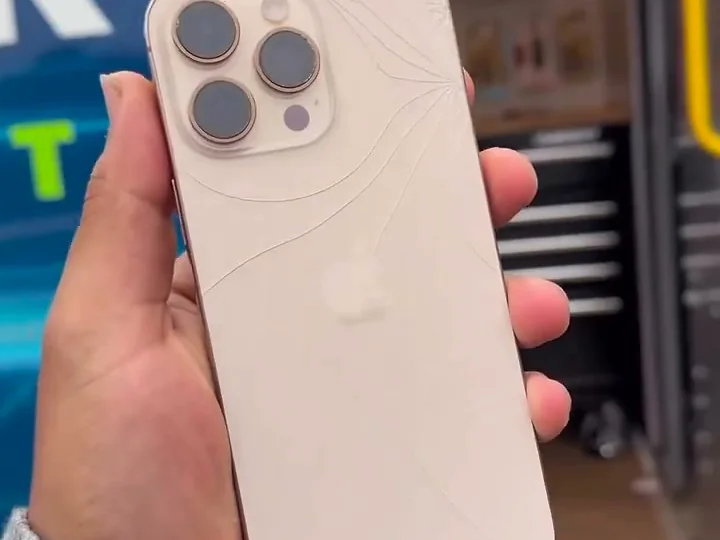 An iPhone with a cracked back glass
