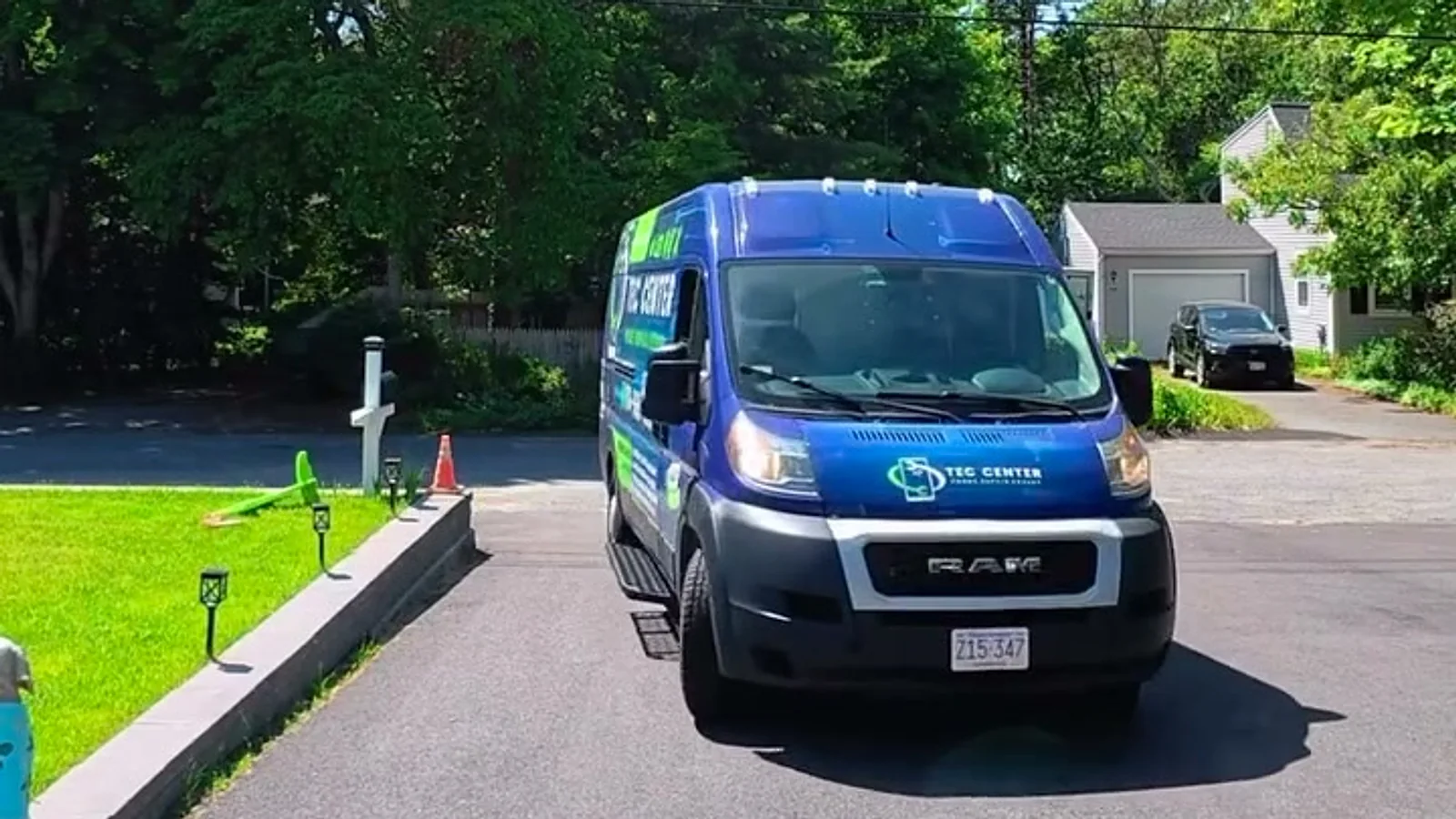 The TEC CENTER van parked in a driveway on Cape Cod